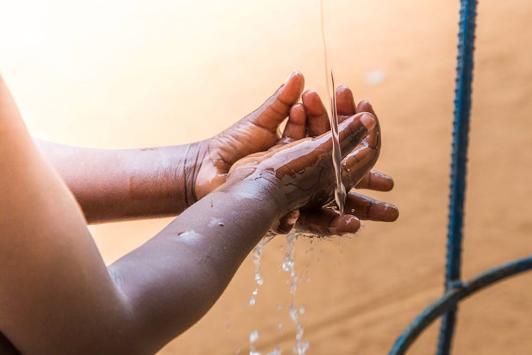 Boy washing hands