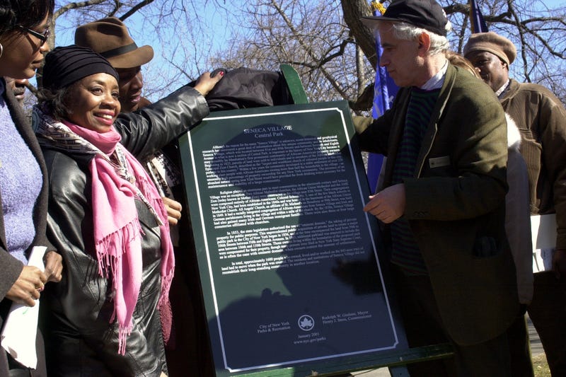 As part of the celebration of Black History Month, a historical sign is unveiled commemorating Seneca Village, probably Manhattan's first prominent community of African-American property owners. The village was located between 81st and 89th Sts. and between Seventh and Eighth Aves., in what is now a section of Central Park. Circa 2000.