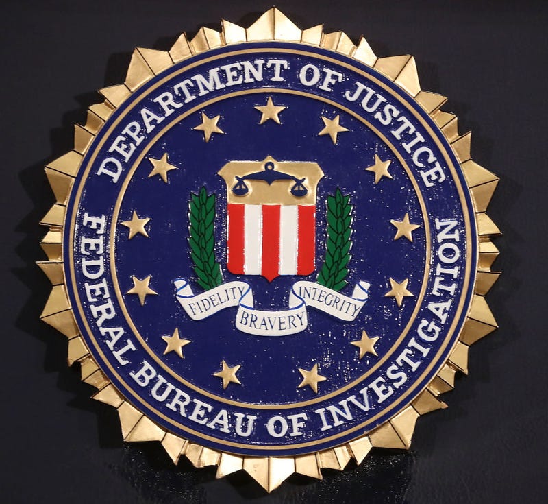 The FBI seal is attached to a podium at FBI Headquarters, on June 14, 2018 in Washington, DC.