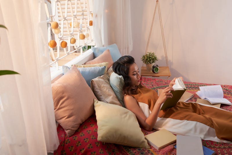 college girl relaxing in dorm room