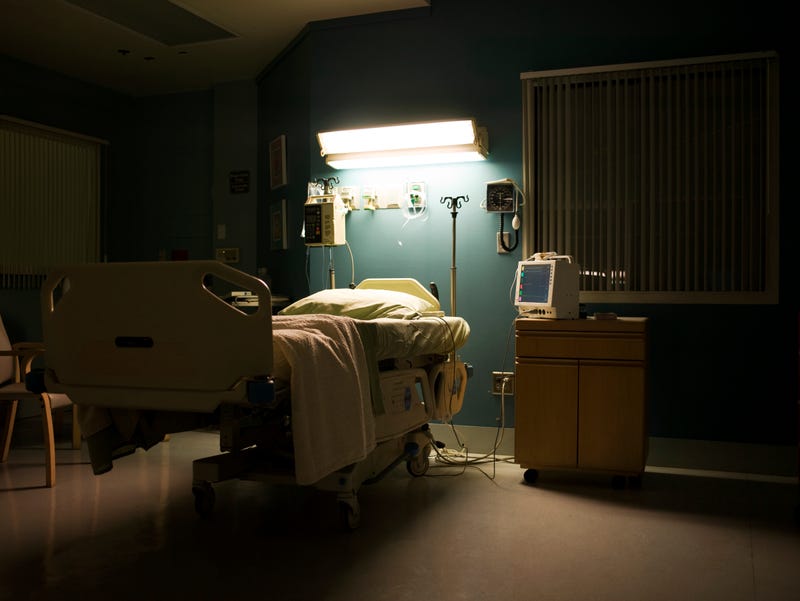 Bed in darkened empty hospital room - stock photo USA, California, Hawthorne