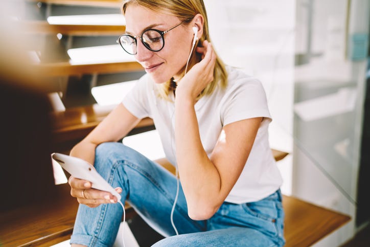 Girl with headphones and phone