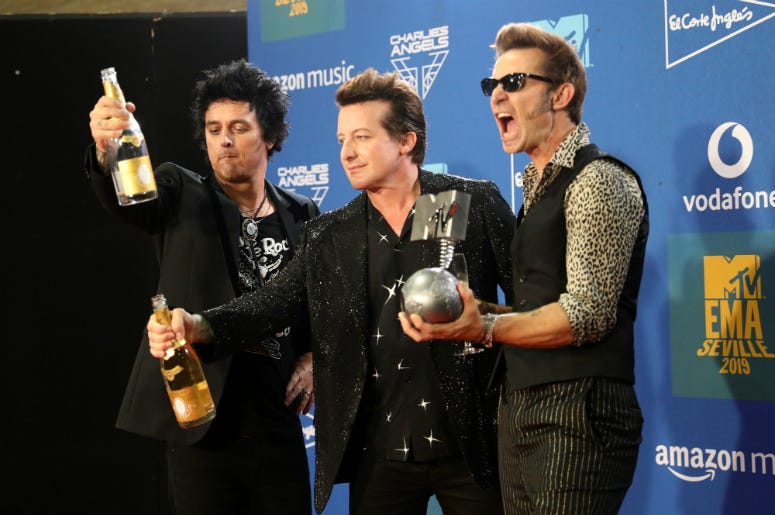 Billie Joe Armstrong, Tre Cool and Mike Dirnt from Green Day with the Best Rock Award in the winners room during the MTV EMAs 2019
