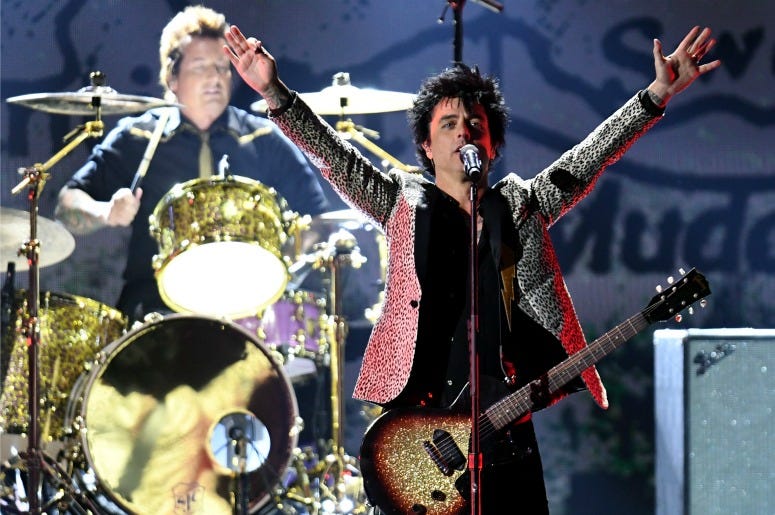 Green Day performs on stage