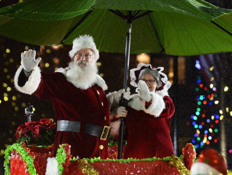 Santa and Mrs. Claus at the Greenville Poinsettia Christmas Parade 2018 in downtown Greenville.