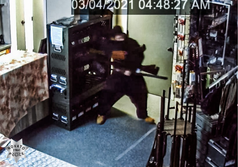 An unidentified man with light or tan completion and short dark hair appears to rummage through inventory after using his vehicle to break into Marin Firearms on Thursday morning.