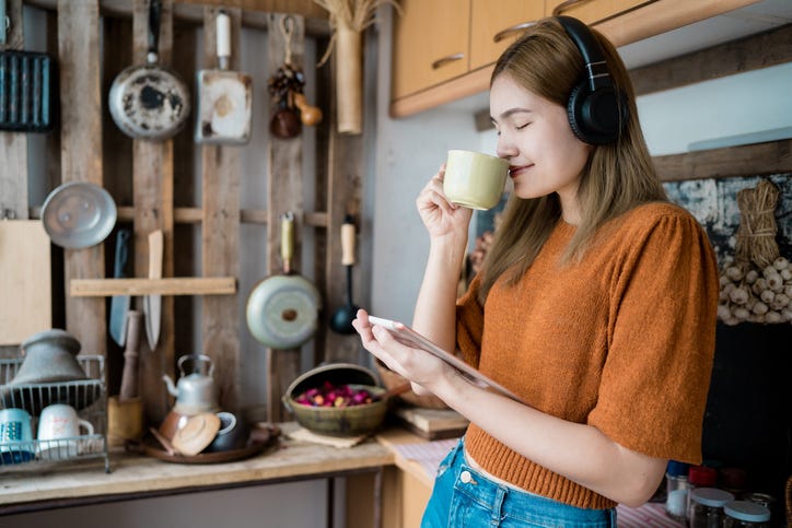 girl wearing headphones in the kitchen