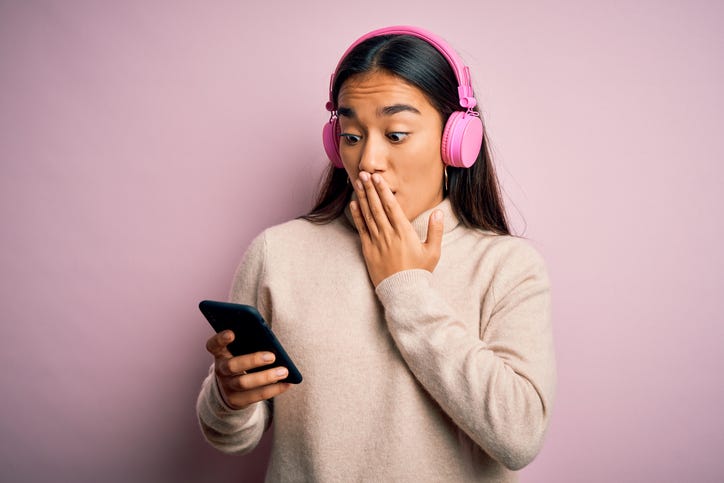 shocked girl wearing headphones