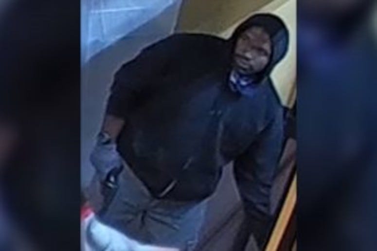 Surveillance video screenshot of a man who police say robbed a Dunkin' Donuts in North Philadelphia early Saturday morning and killed its manager.