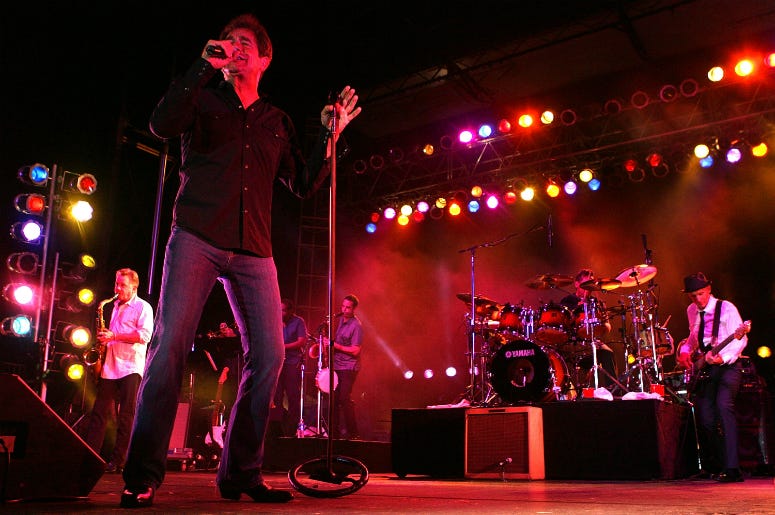 Huey Lewis and the News perform onstage at the ArenaBowl Extravaganza on July 26, 2008
