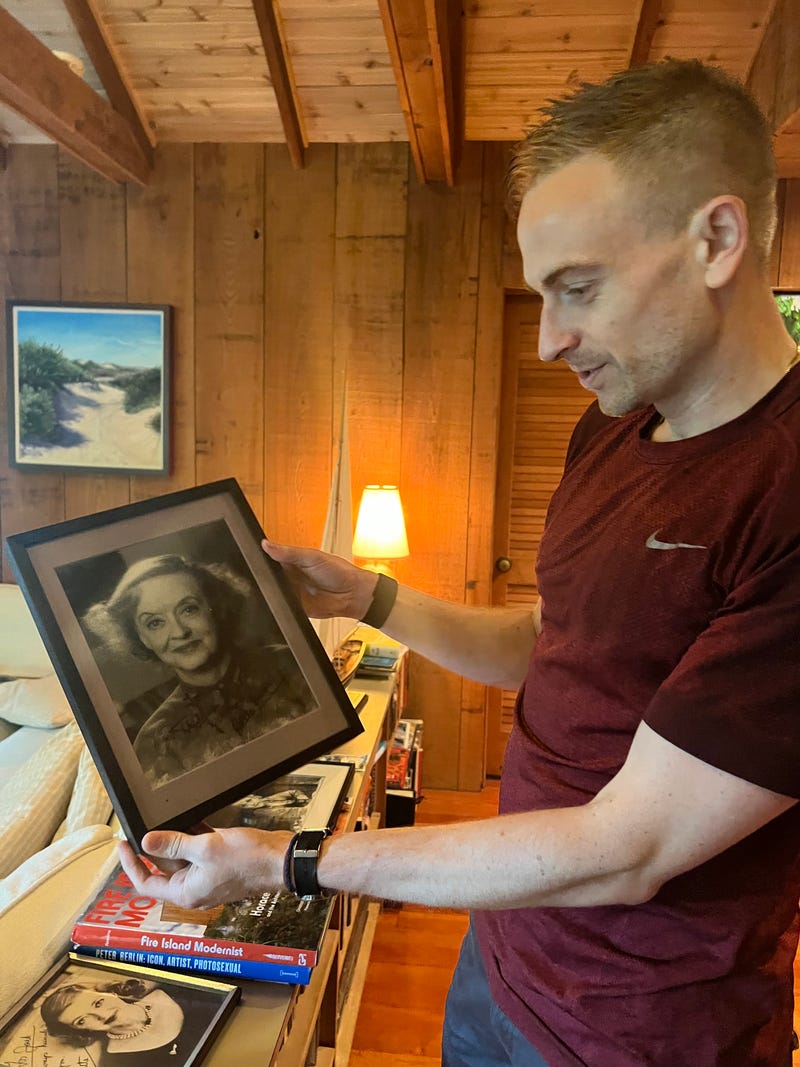 John Dempsey with a signed photo of Bette Davis found in his home