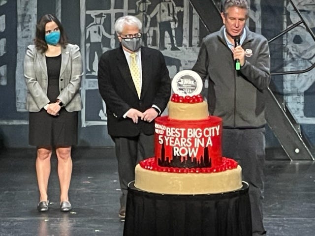 Representatives from Choose Chicago and World Business Chicago celebrate Chicago being selected as "Best Big City" for the fifth year in row by Conde Nast Traveler.