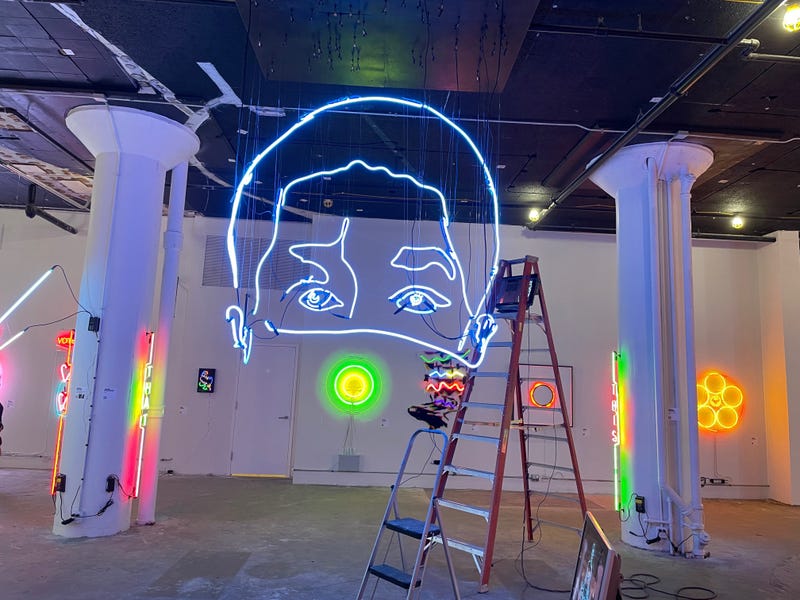 A massive 14-foot-tall neon sculpture by artist John Bannon that changes based on your angle of view at the Neon and Light Museum