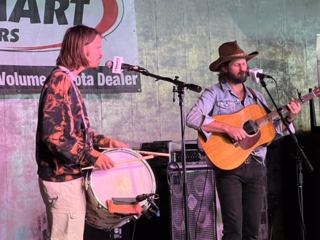 Jake Cochran with snare drum and Jeff Gorman with guitar