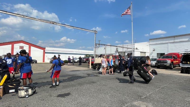 Search and recovery team members from Philadelphia return home after assisting at the site of a collapsed condominium in South Florida.