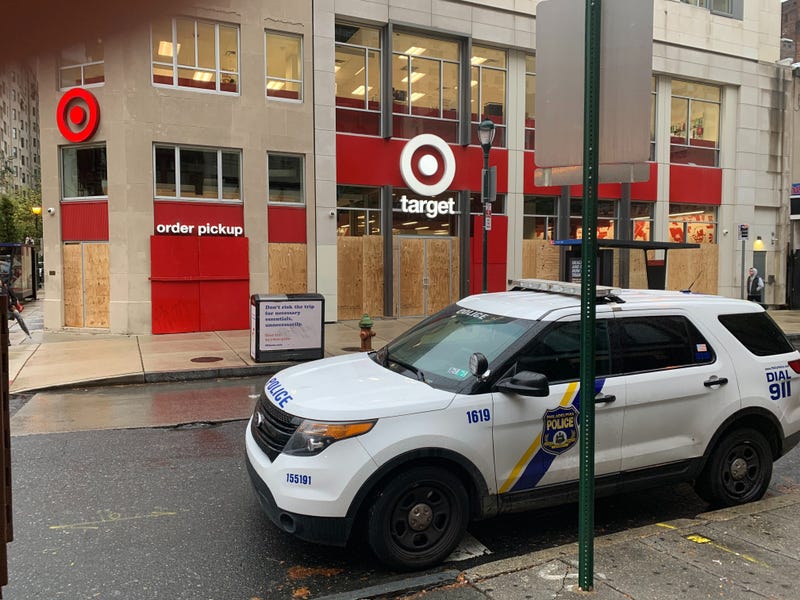 Philadelphia police are stationed at intersections throughout Center City, and many businesses are closed or boarded up on Friday.