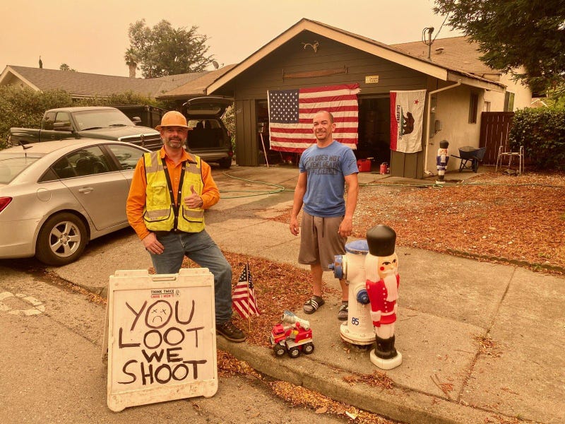 Neighbors John Allen and Al Smith protect Santa Rosa’s Rincon Valley neighborhood after the Glass Fire moved through.