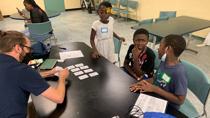 Staff from Revolution at the Library engage kids at Haddington Library in West Philly.