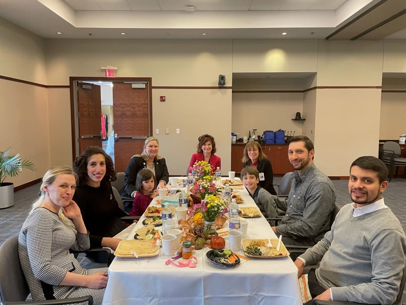 Katie Strickland (far left) and Anna Fischman (right of Strickland) reunited at the Gift of Life Donor Program's Thanksgiving dinner in Philadelphia.