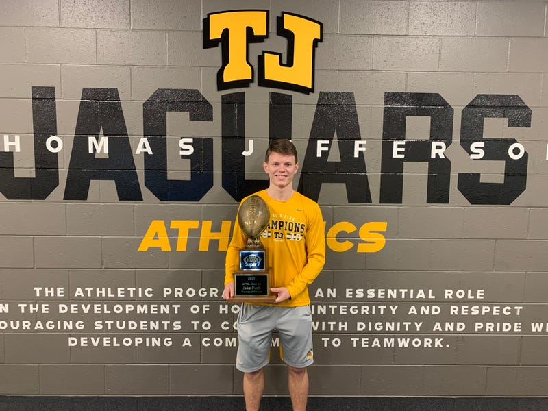 Thomas Jefferson quarterback Jake Pugh poses with his award as KDKA Radio Super 7 4A Player of the Year inside the Jaguars athletic facility.