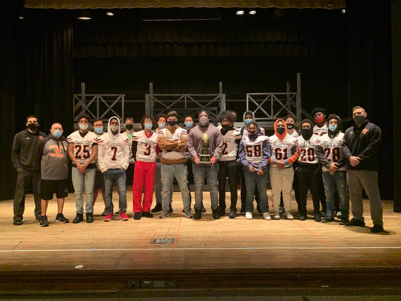 Hough poses with his Super 7 trophy with the rest of his Tigers teammates at an assembly held to honor the Syracuse committ.