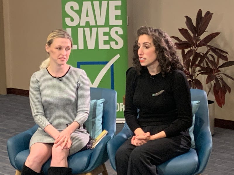 Katie Strickland (left) and Anna Fischman speak at the Gift of Life's Thanksgiving dinner reunion in Philadelphia.