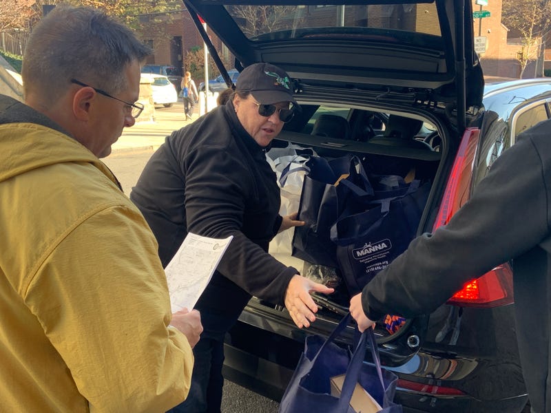MANNA volunteers coordinate meal delivery.