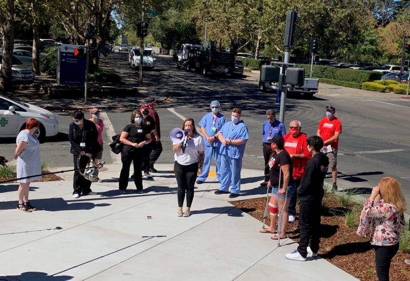 Workers at Memorial Hospital in Santa Rosa rally against the hospital's response to the pandemic.