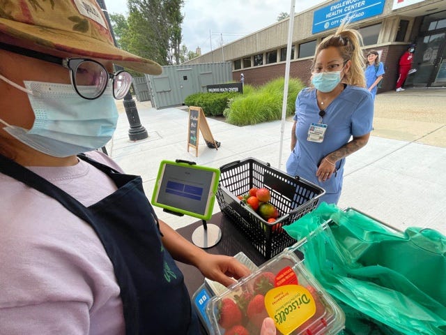 The mobile bus takes food access vouchers, link cards, and offers discounts on fresh produce.