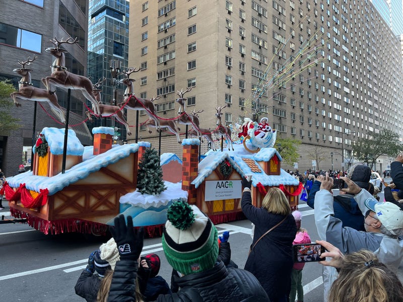 Reliably bringing up the rear, as they do every year: Santa and Mrs. Claus