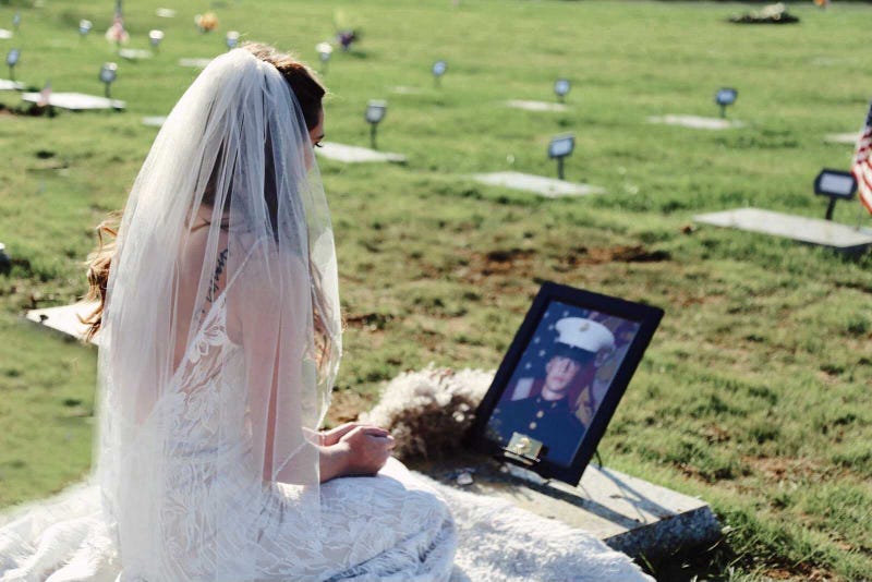 Chelsea Todd wore her wedding dress to visit the grave of fiancé, Marine veteran Patrick Duva, for the first time. Duva died just weeks before the couple's wedding day of a rare cancer his family believes was caused by toxic exposure during military service.