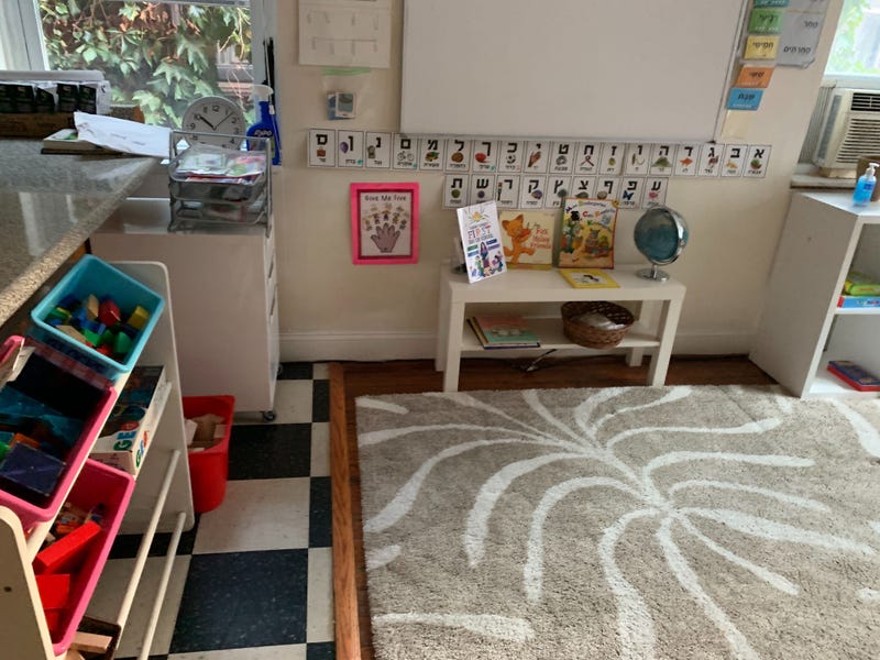 Hadas Kuznits' children learn in a micro school set up in an apartment with other families.