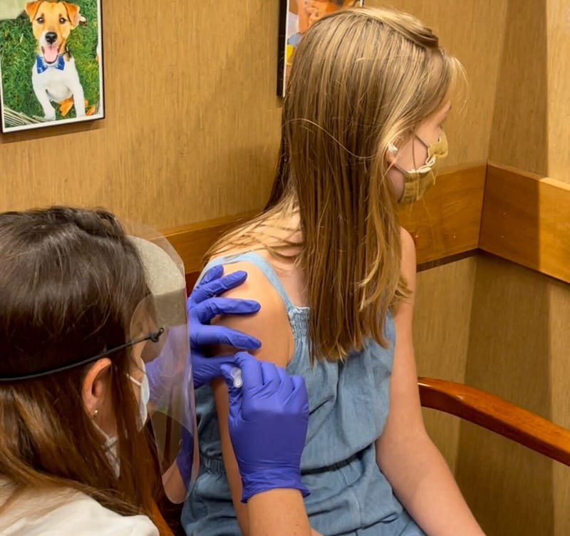 Girl gets COVID-19 vaccine