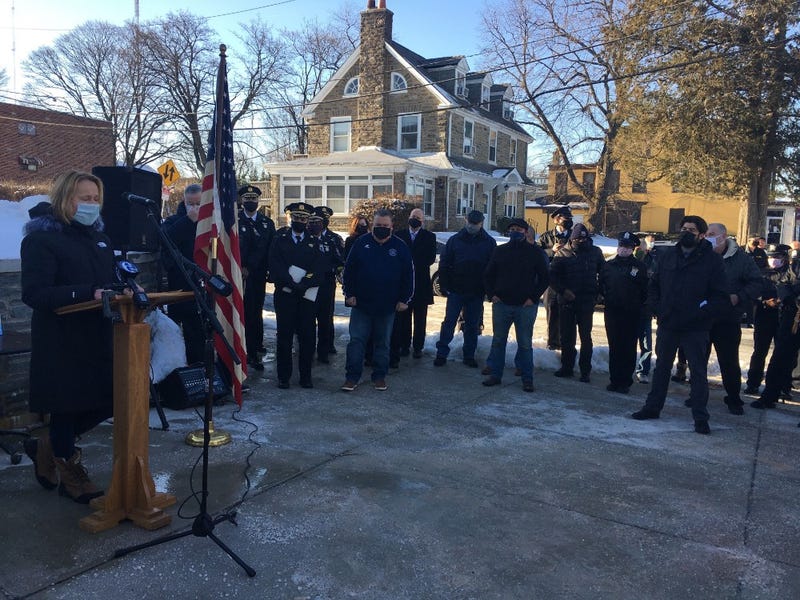 Philadelphia police officers and community members honor Officer Tab Ali, who died from COVID-19 in November.