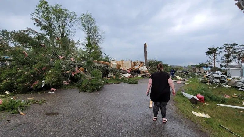 At least one person is dead and 23 others are injured after a "large tornado" bore down on Gaylord, Mich., tearing homes from their foundations and destroying businesses Friday afternoon, the AP reported.