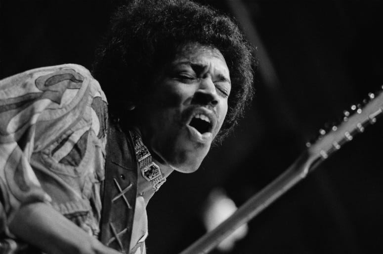 Rock guitar virtuoso Jimi Hendrix (1942 - 1970) caught mid guitar-break during his performance at the Isle of Wight Festival, August 1970