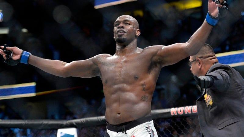 UFC star Jon Jones poses in the Octagon after fighting Daniel Cormier.