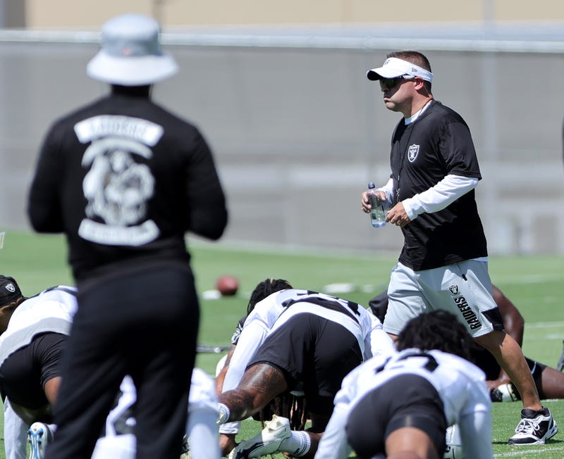 Raiders head coach Josh McDaniels oversees an off--season workout
