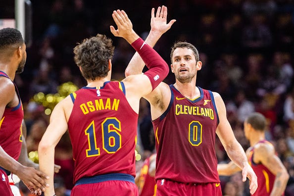 Kevin Love high fives teammate