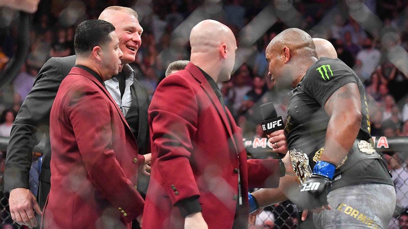 Brock Lesnar confronts UFC heavyweight champion Daniel Cormier in the cage at UFC 226.