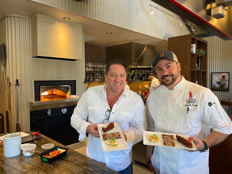 Liam Mayclem with Chef Derek at B Cellars