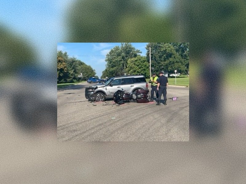 Motorcycle hit by Ford Bronco