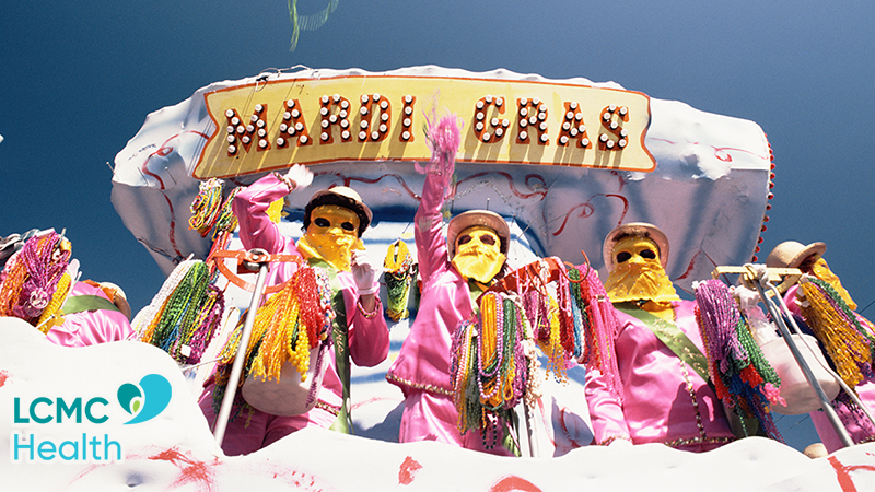Mardi Gras float with riders throwing beads