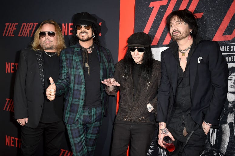 Vince Neil, Nikki Sixx, Mick Mars and Tommy Lee of Motley Crue arrive at the premiere of Netflix's "The Dirt"