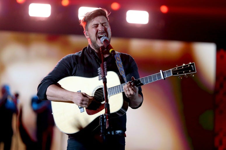 Marcus Mumford of Mumford & Sons performs onstage