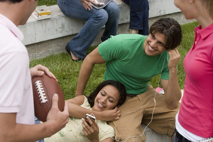 people listening to music, football