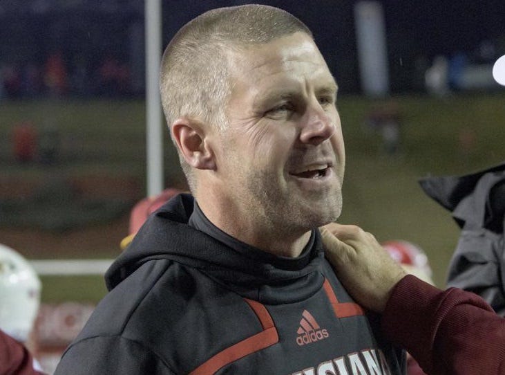 Louisiana-Lafayette head coach Billy Napier is congratulated by Louisiana-Monroe Offensive Coordinator Rich Rodriguez after Louisiana-Lafayette won 21-16 in an NCAA college football game in Lafayette, La., Saturday, Nov. 27, 2021.
