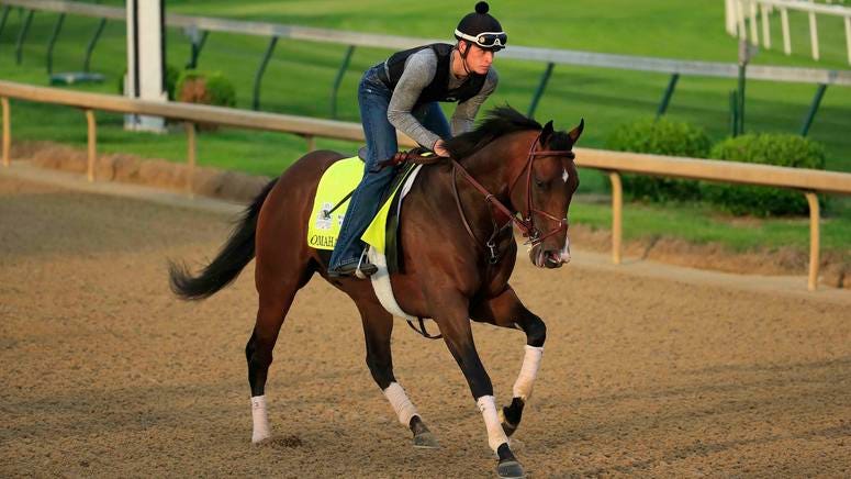 Omaha Beach, who was scratched from the 2019 Kentucky Derby, works out on the track.