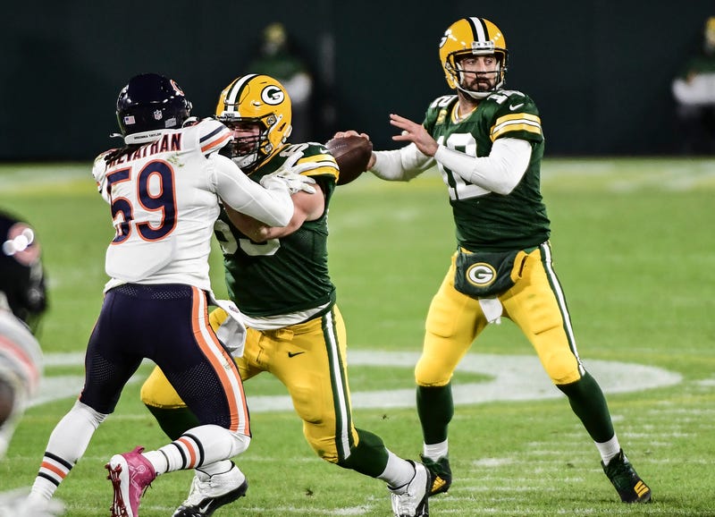 Nov 29, 2020; Green Bay, Wisconsin, USA; Green Bay Packers quarterback Aaron Rodgers (12) looks to pass in the first quarter during the game against the Chicago Bears at Lambeau Field. Mandatory Credit: Benny Sieu-USA TODAY Sports