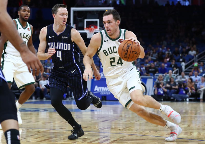 Nov 1, 2019; Orlando, FL, USA; Milwaukee Bucks guard Pat Connaughton (24) drives to the basket as Orlando Magic guard Josh Magette (4) defense during the second half at Amway Center. Mandatory Credit: Kim Klement-USA TODAY Sports